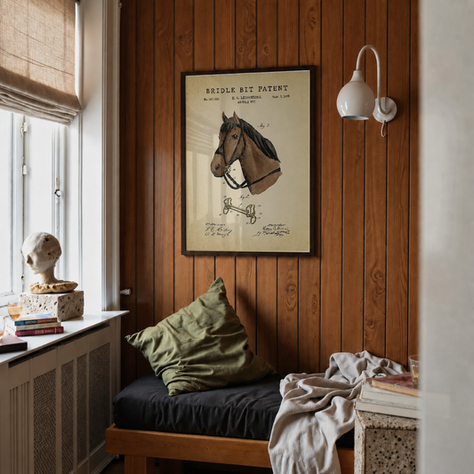 Bridle bit patent print framed above a bed in a bedroom