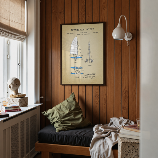 Catamaran patent print framed above a bed in a bedroom