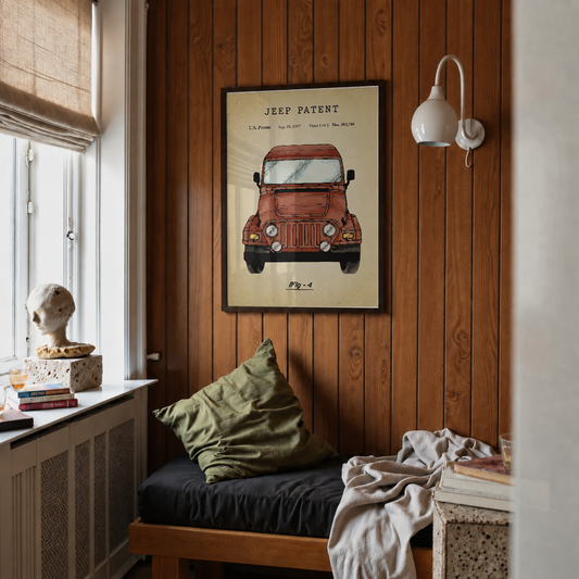 Jeep patent print framed above a bed in a bedroom