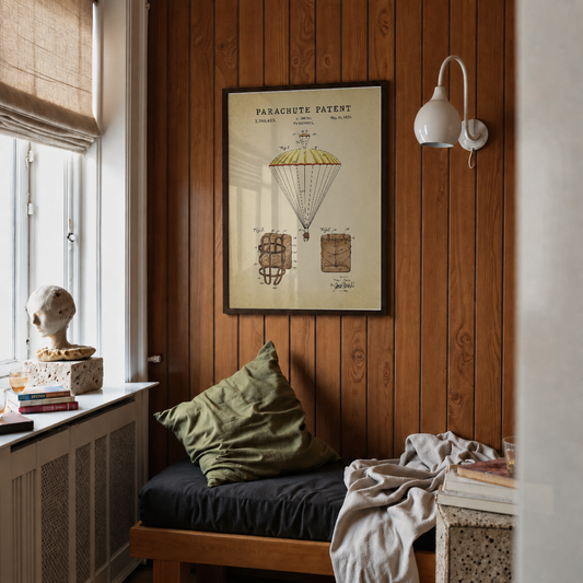 Parachute patent print framed above a bed in a bedroom