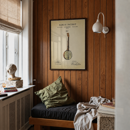 Banjo patent print framed above a bed in a bedroom