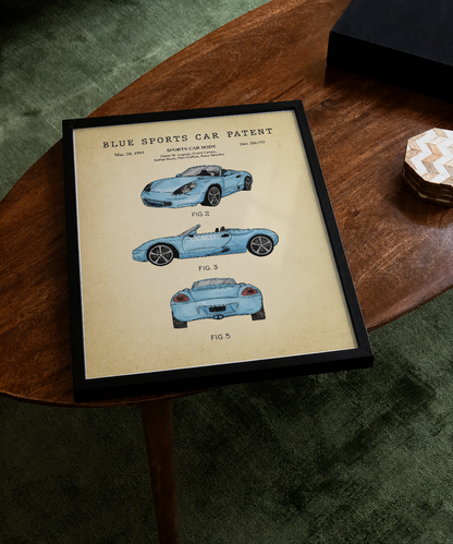 Blue sports car patent print displayed on a tabletop