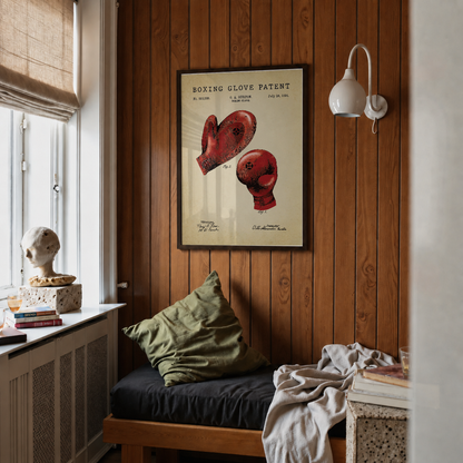 Boxing glove patent print framed above a bed in a bedroom