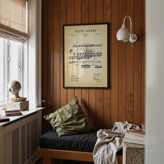 Flute patent print framed above a bed in a bedroom