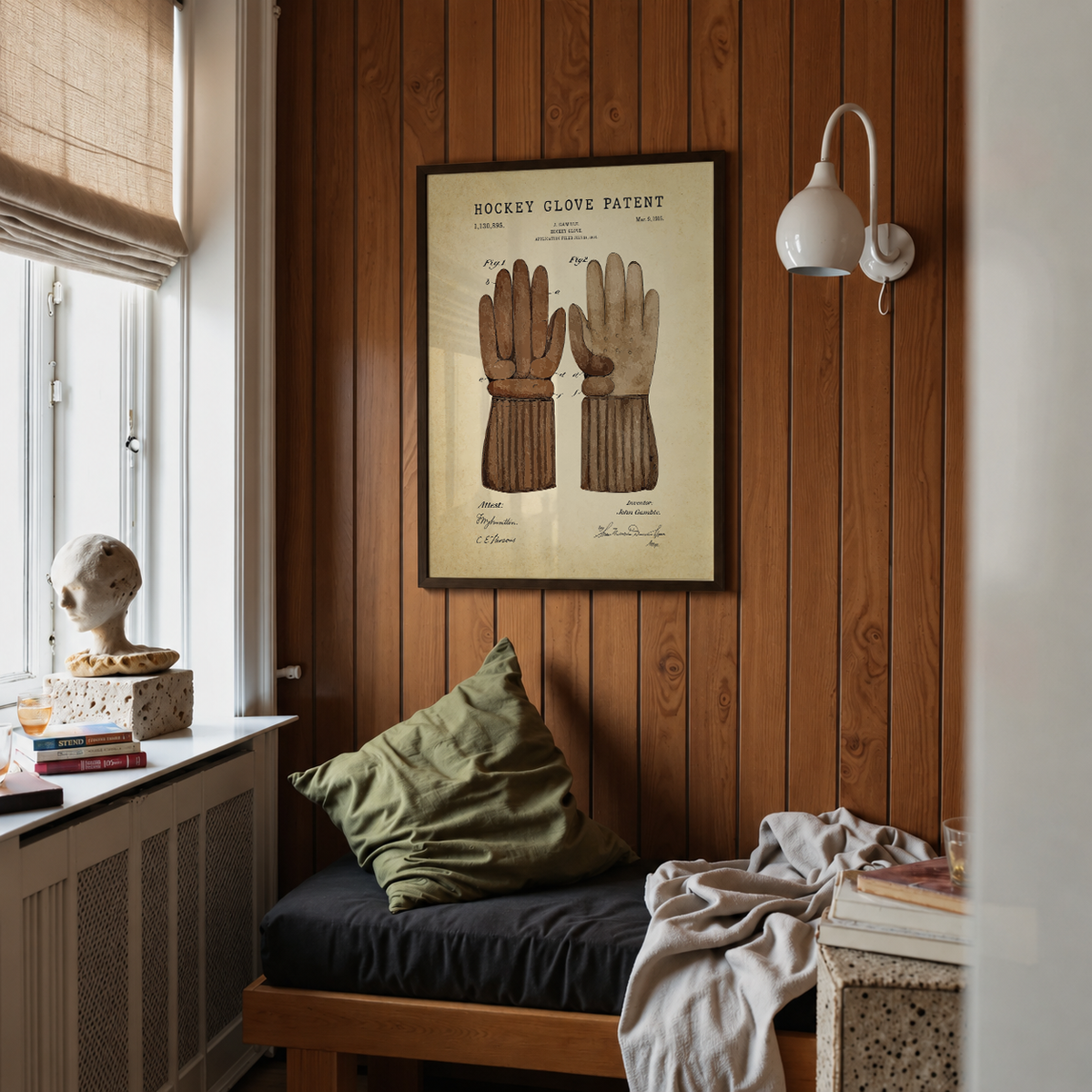 Hockey glove patent print framed above a bed in a bedroom