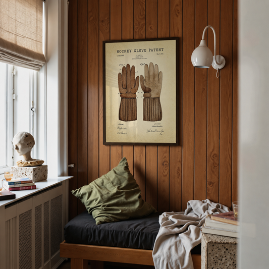 Hockey patent print framed above a bed in a bedroom
