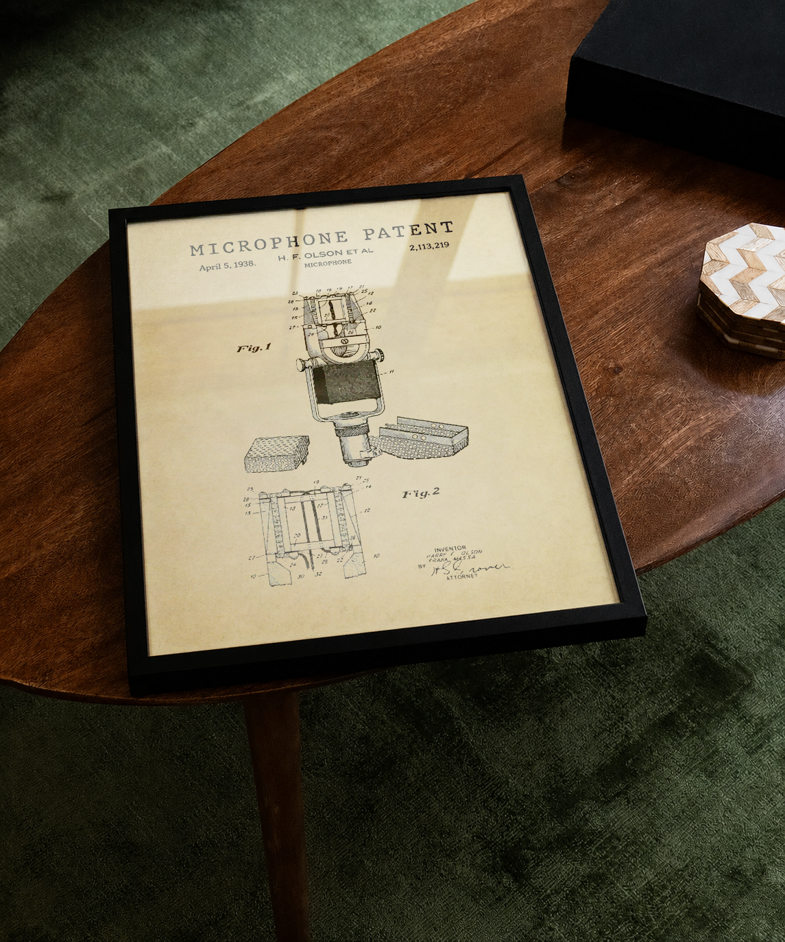 Microphone patent print displayed on a tabletop