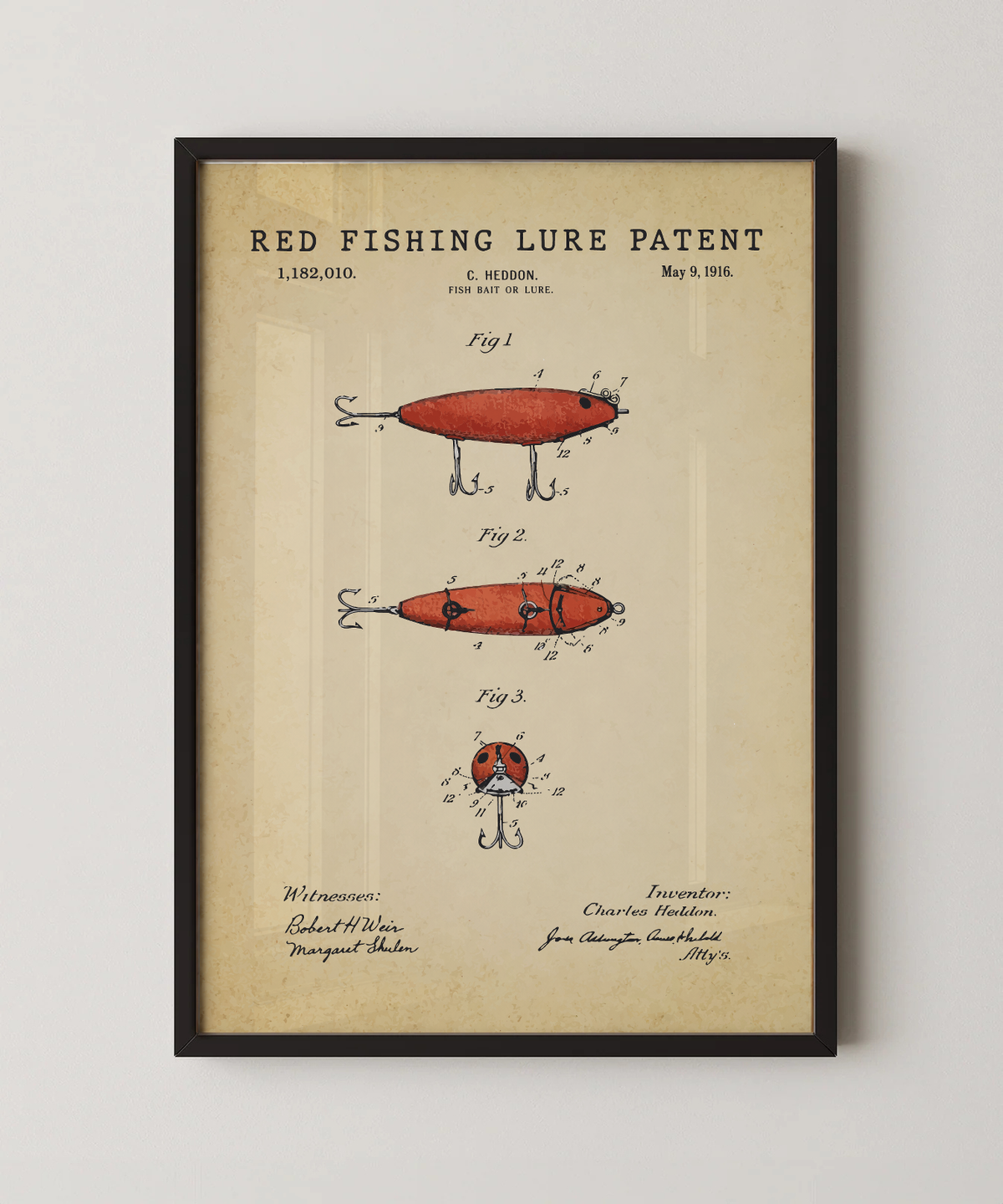 Red fishing lure patent print in a black frame