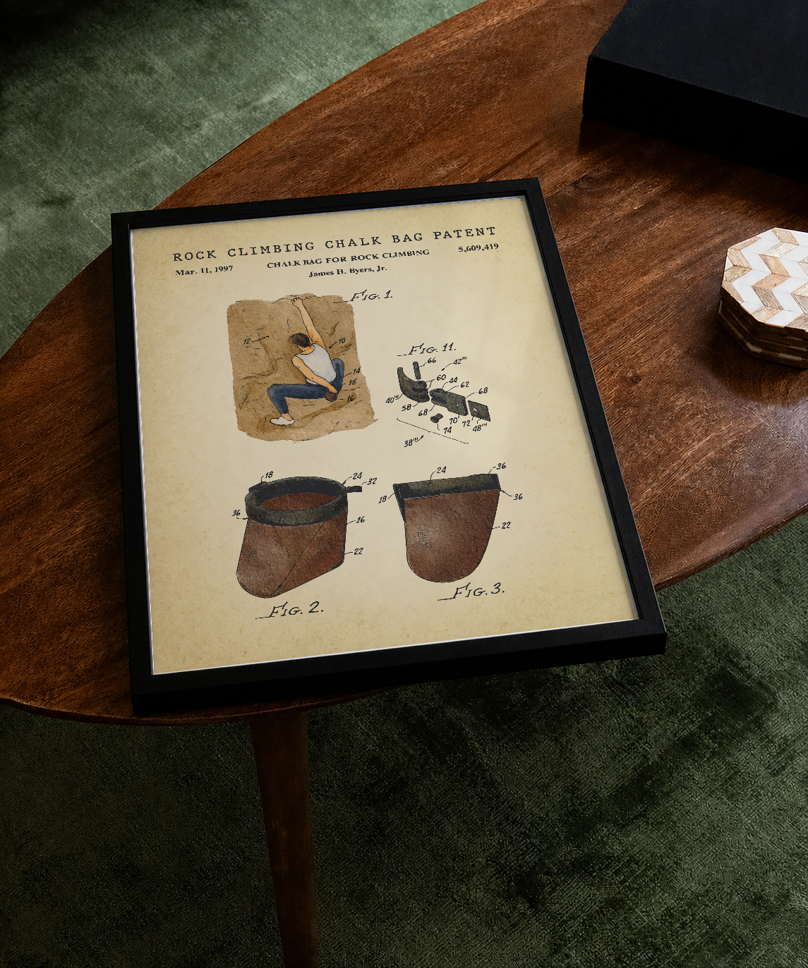 Rock climbing chalk bag patent print displayed on a tabletop