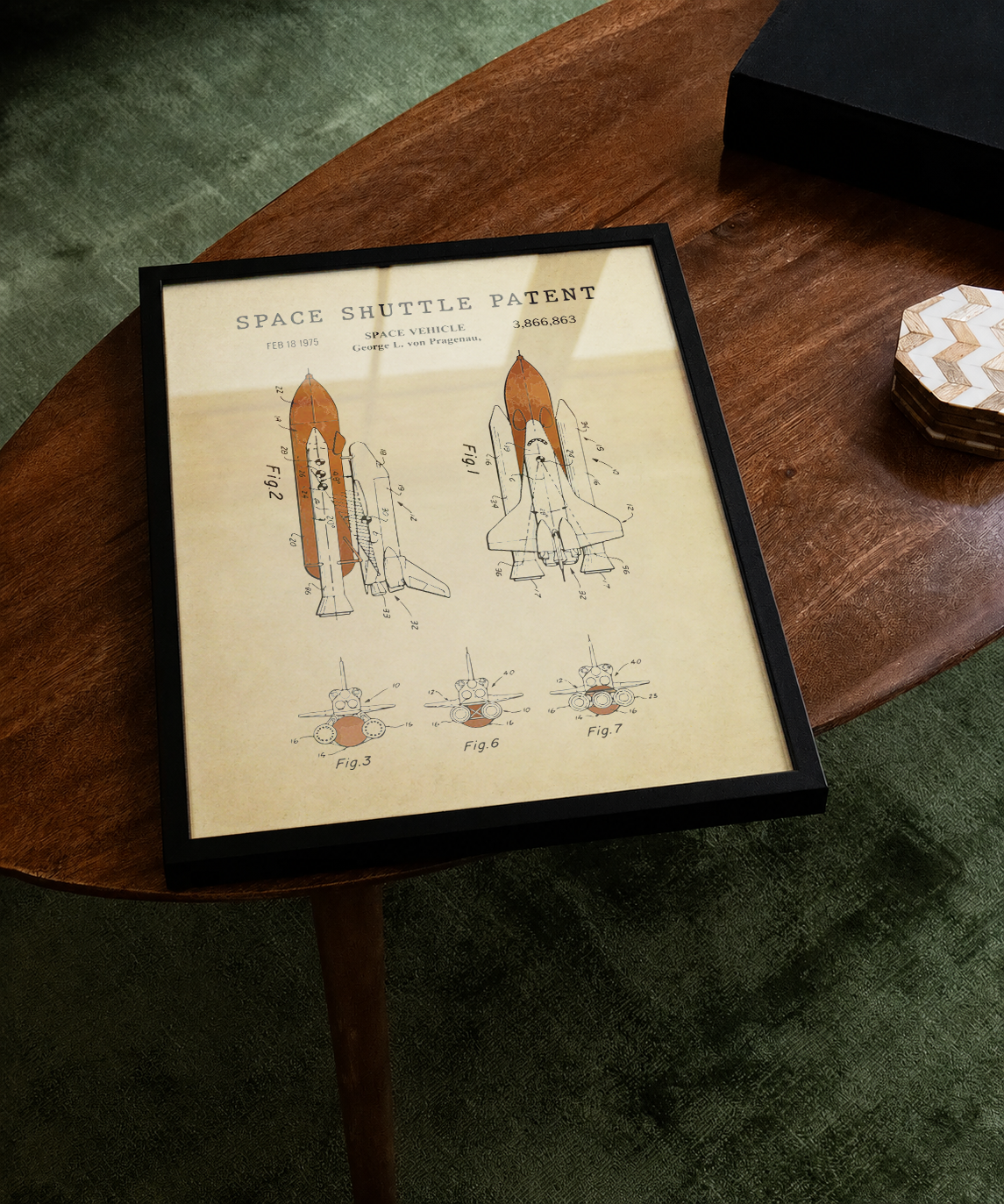 Space shuttle patent print displayed on a tabletop
