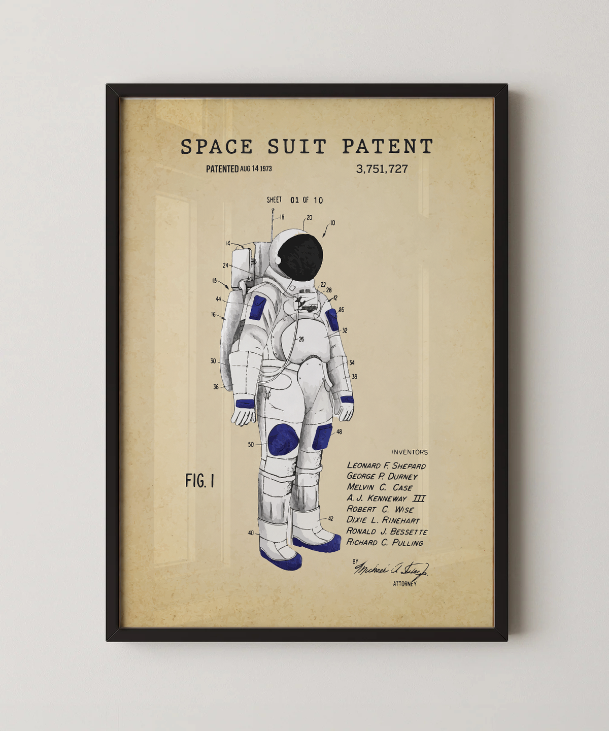 Space suit patent print in a black frame