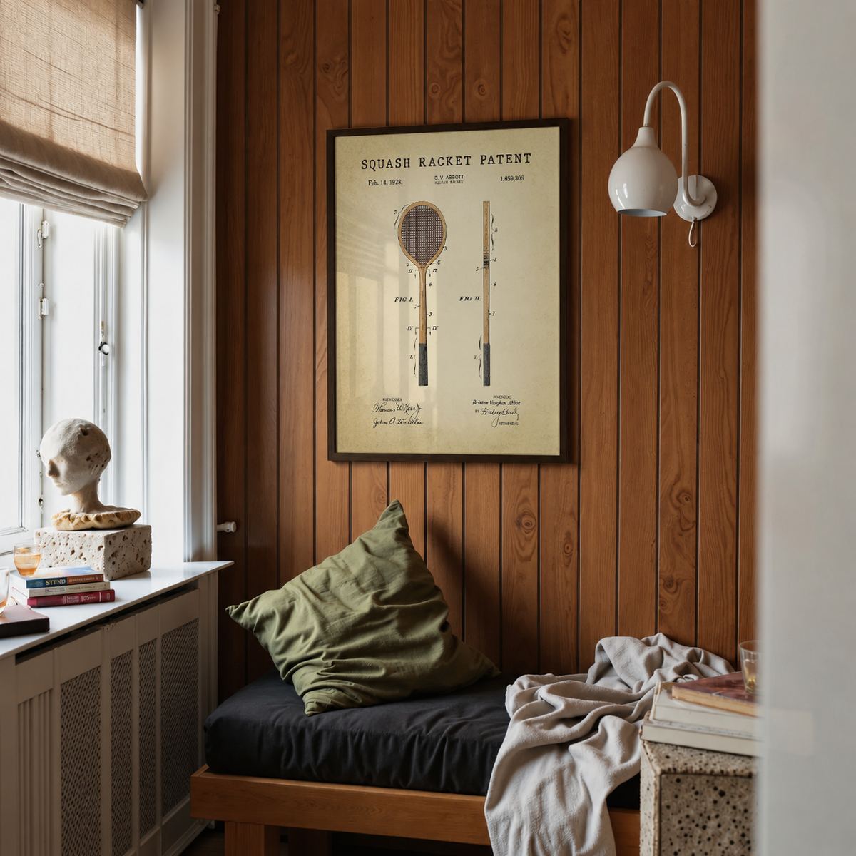 Squash racket patent print framed above a bed in a bedroom
