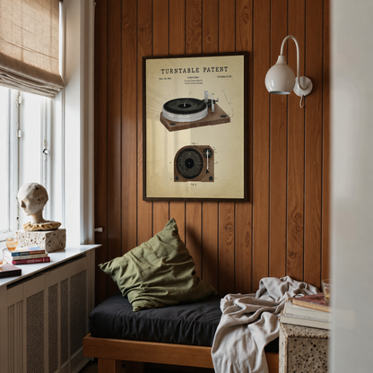 Turntable patent print framed above a bed in a bedroom
