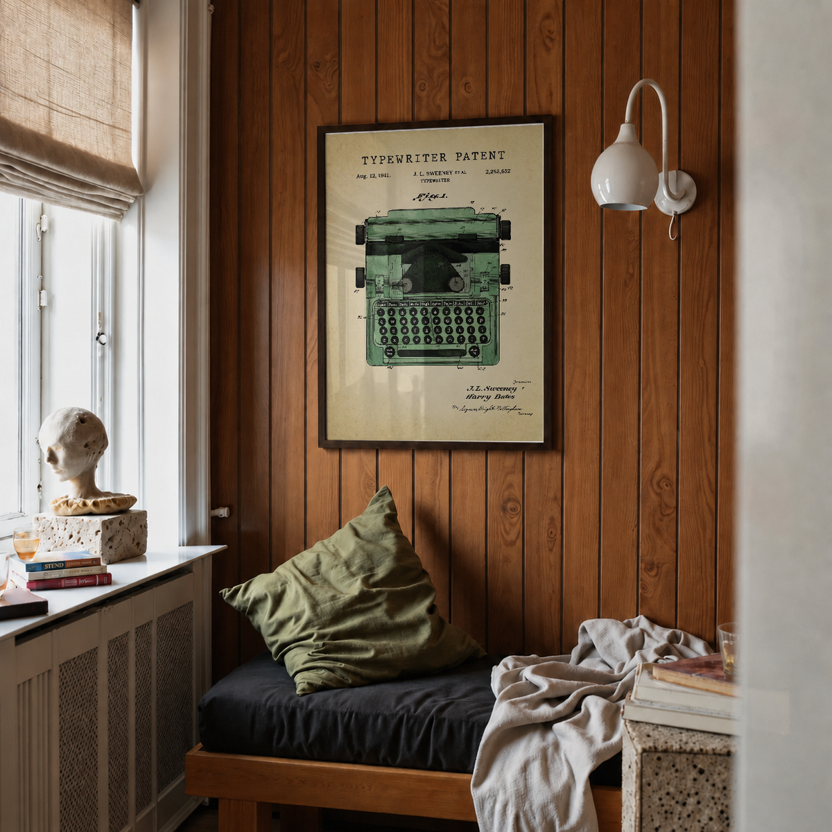 Typewriter patent print framed above a bed in a bedroom