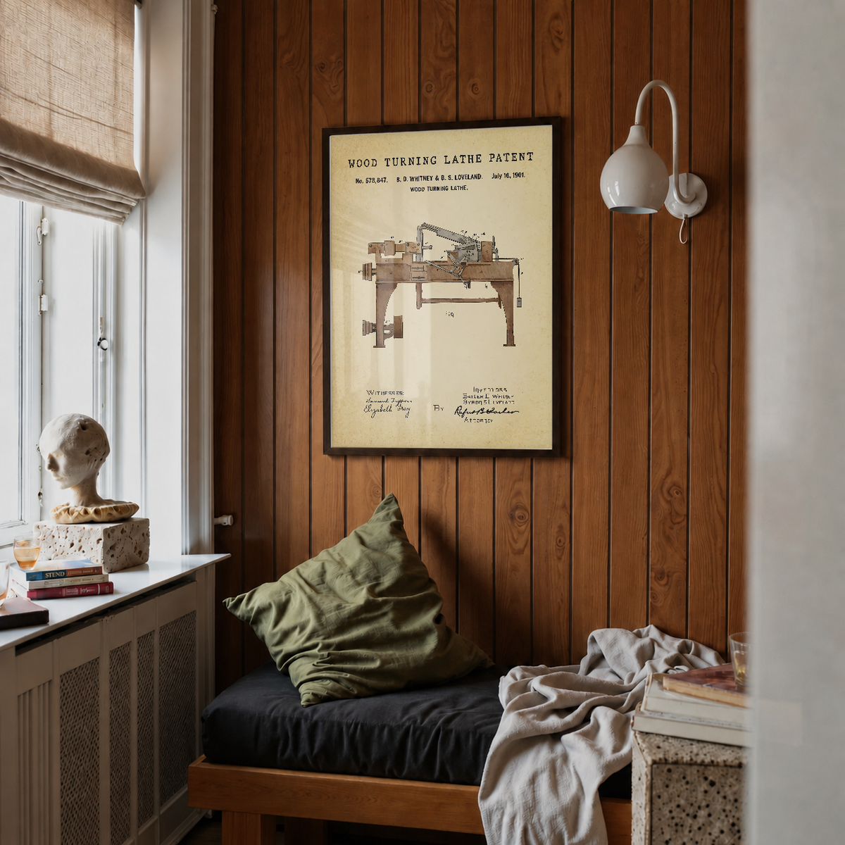 Wood turning lathe patent print framed above a bed in a bedroom